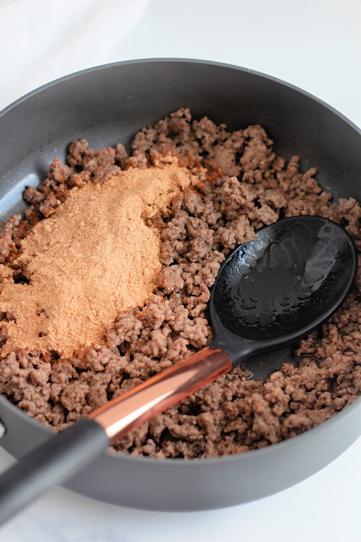browning the ground beef with taco seasoning