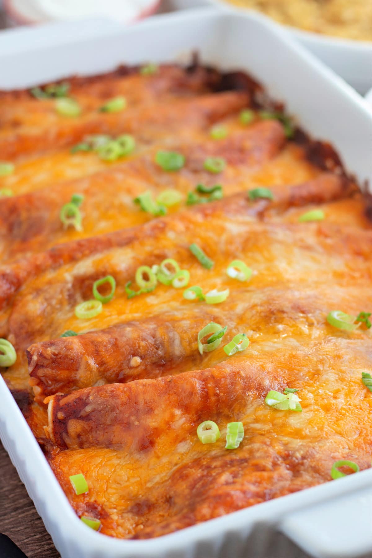 Baking dish with freshly baked beef enchiladas