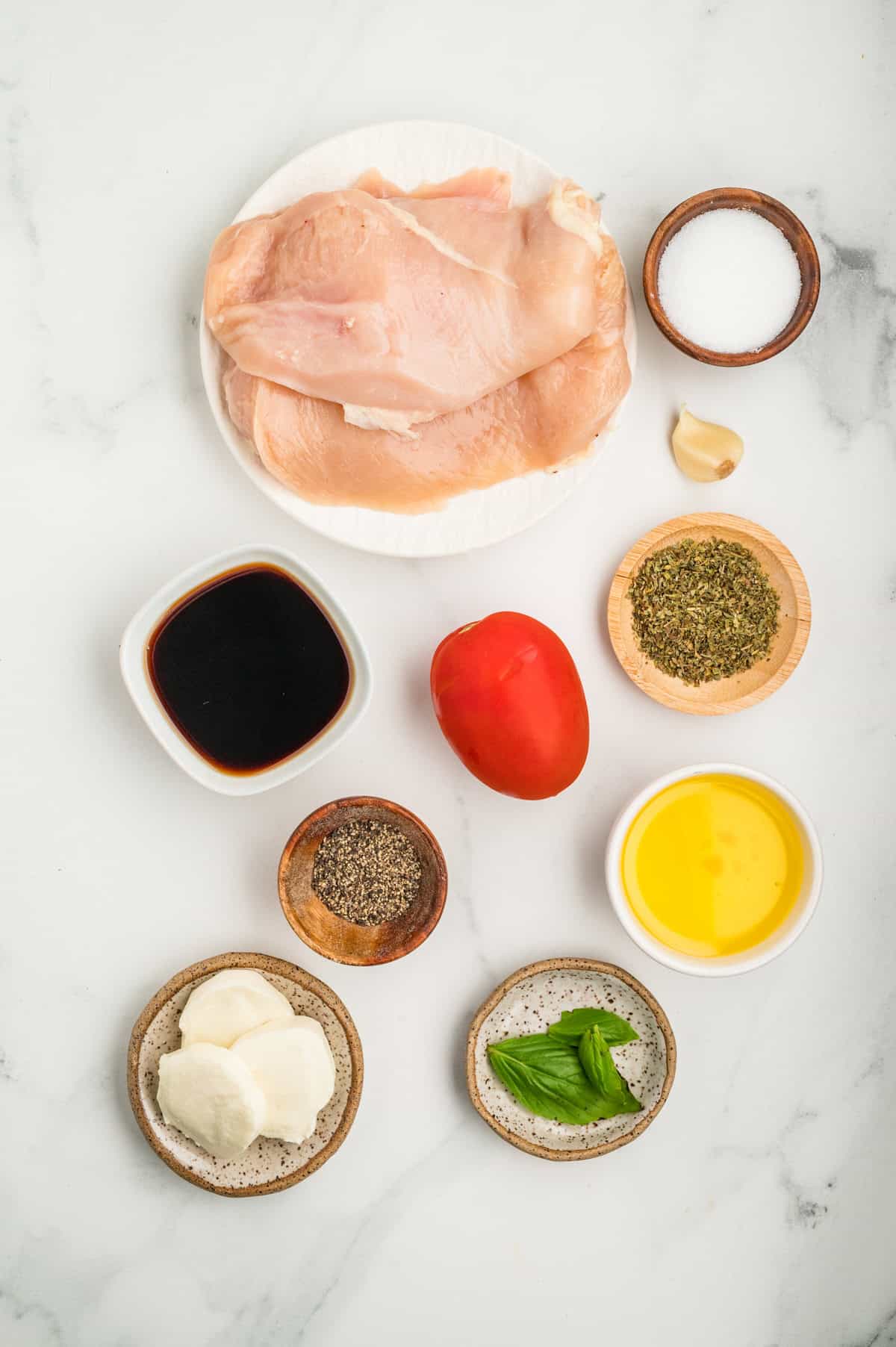 Overhead view of ingredients needed to make chicken caprese