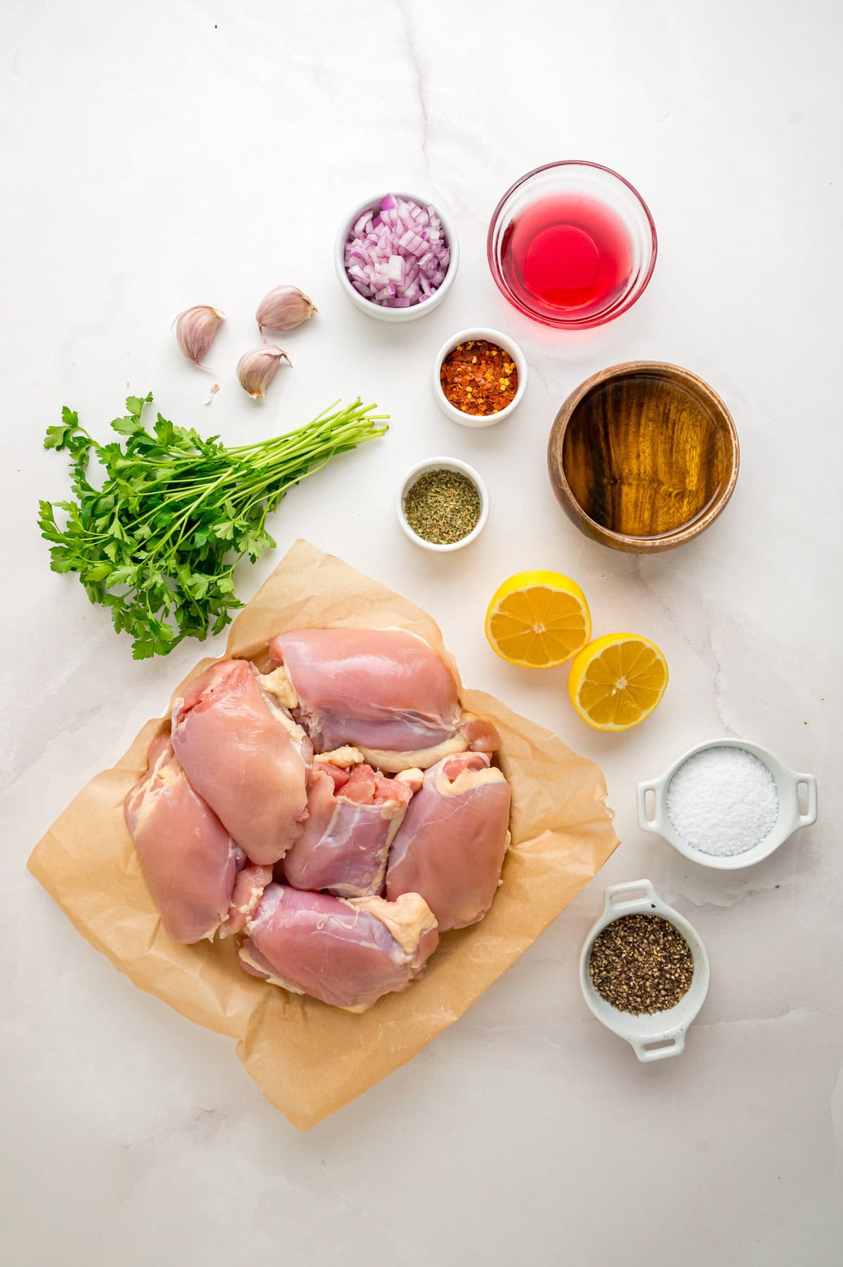 Overhead view of ingredients needed to make chimichurri sauce