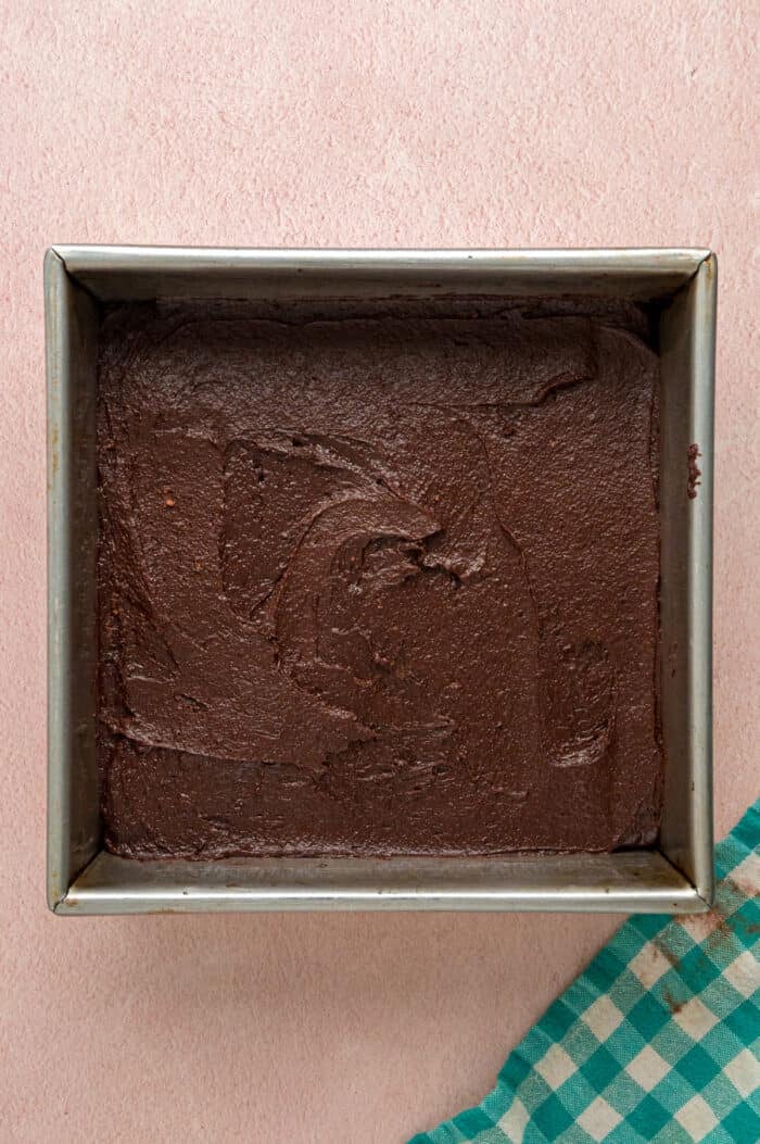 Brownie batter in a square pan