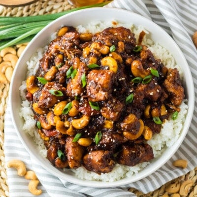 Crockpot Cashew Chicken on a striped cloth.