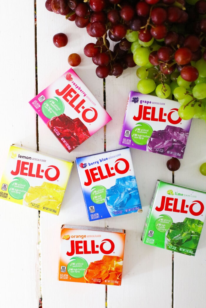 Candy Grapes are frozen grapes dipped and coated in a thin layer of vibrant and flavored Jello mix. boxes of Jello
