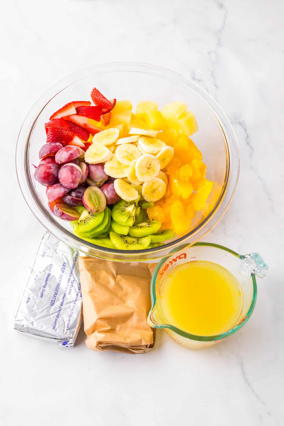 Overhead view of ingredients needed to make Hawaiian cheesecake salad