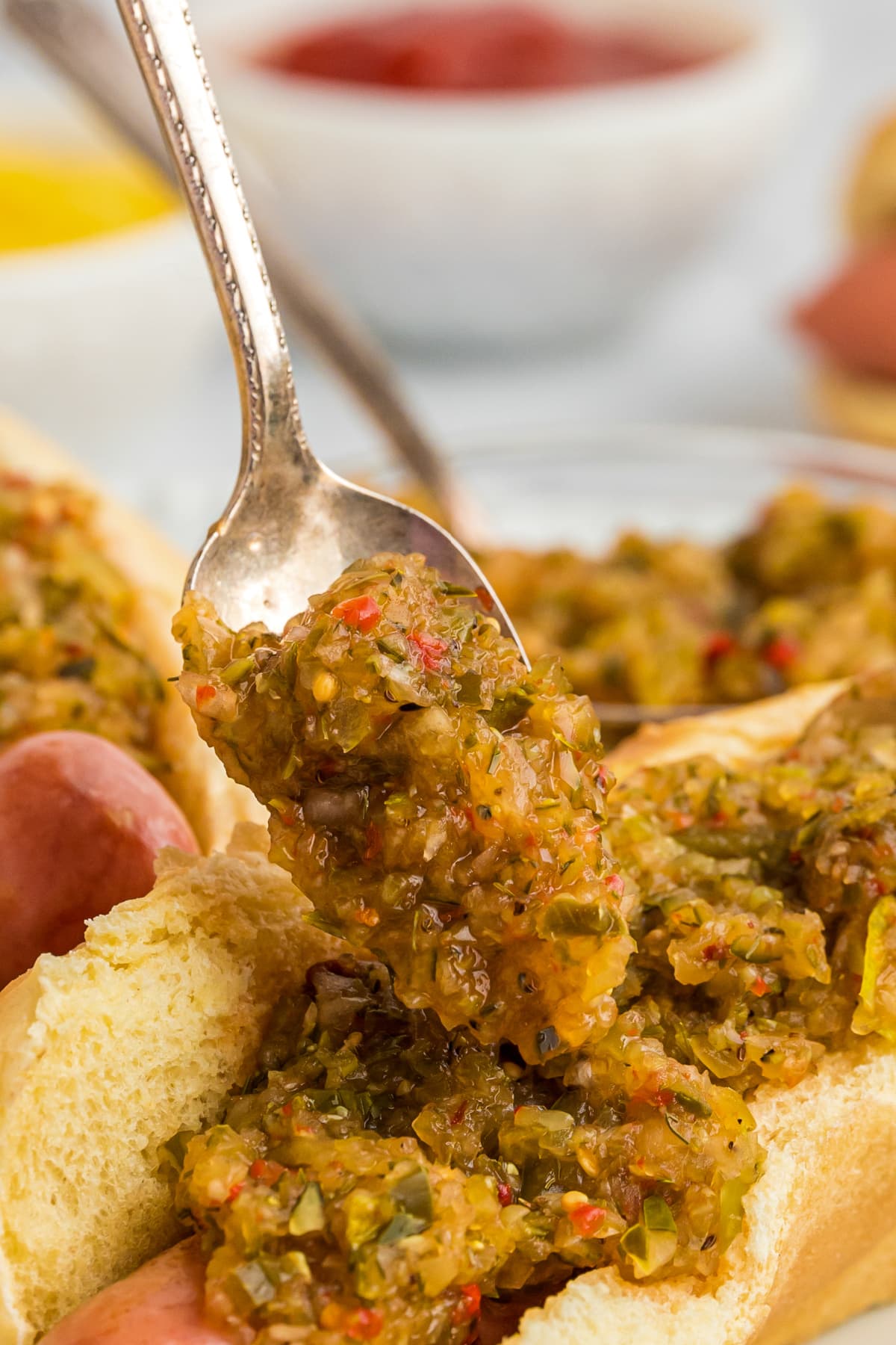 hot dog relish spooned on top of hot dog