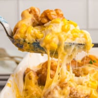 A spoon lifting up some of the KFC Bowl Casserole.