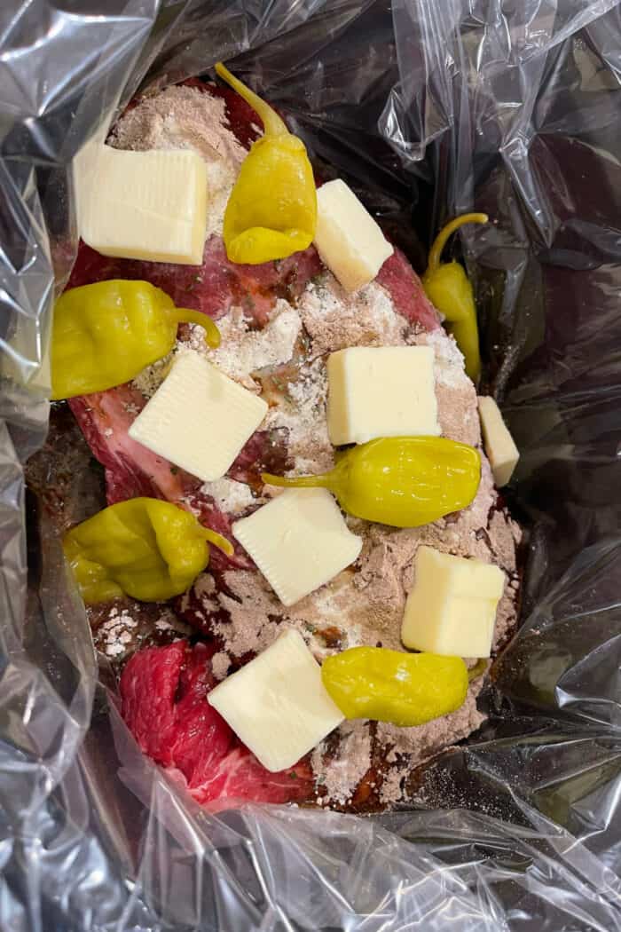 Mississippi pot roast ingredients in the slow cooker