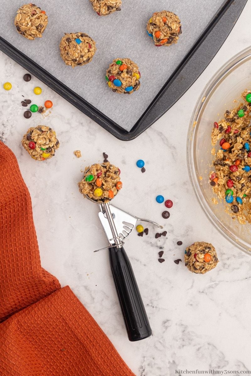 A scooper picking up some of the dough.