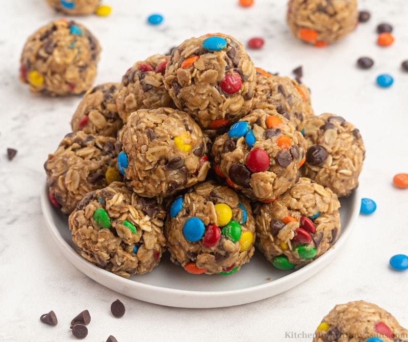 Some of the bites on a serving plate with extra chocolate chips and M&M's.