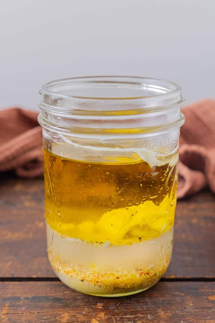 Creamy Italian dressing ingredients in a jar