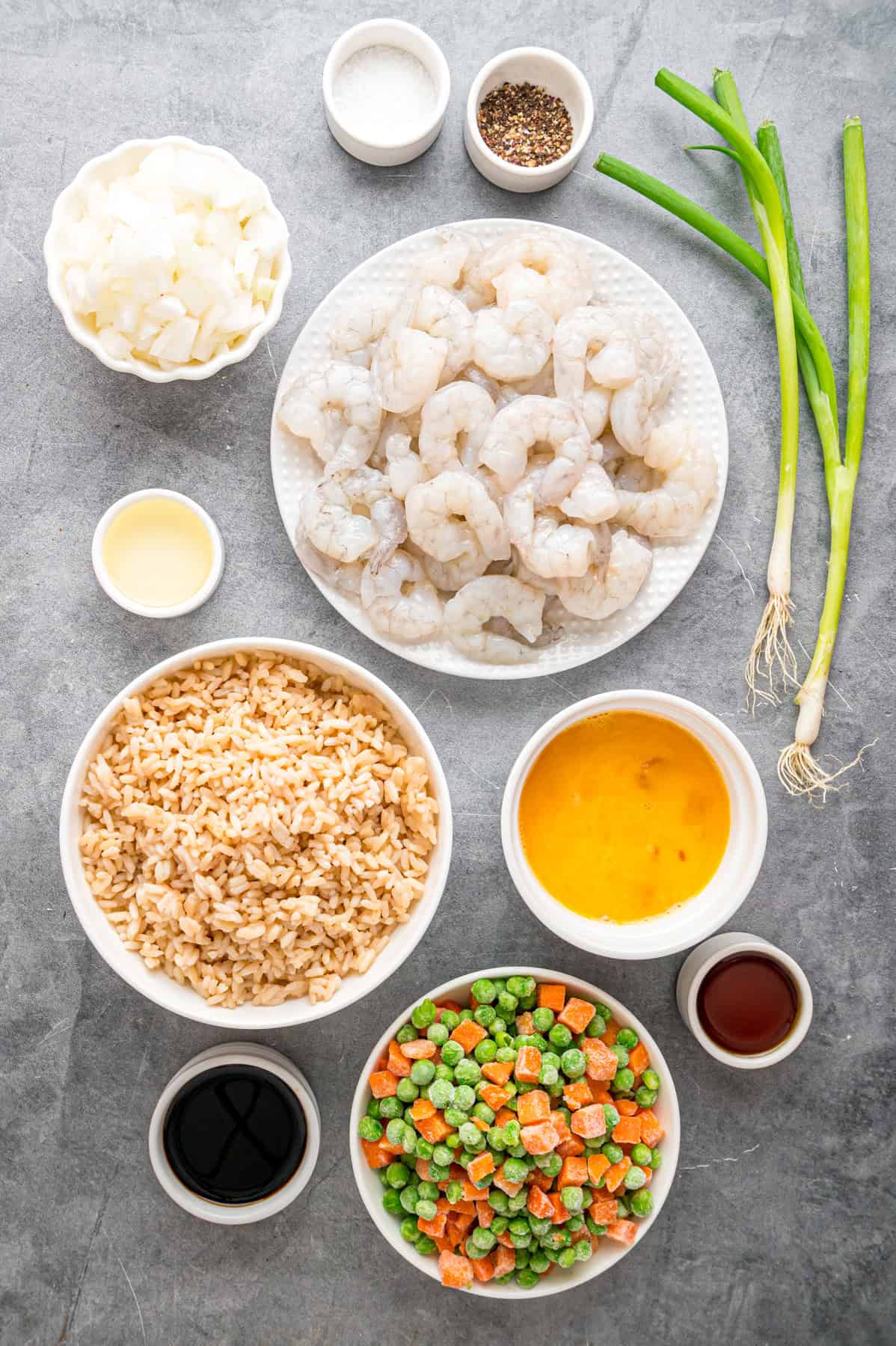 Overhead view of ingredients needed to make shrimp fried rice